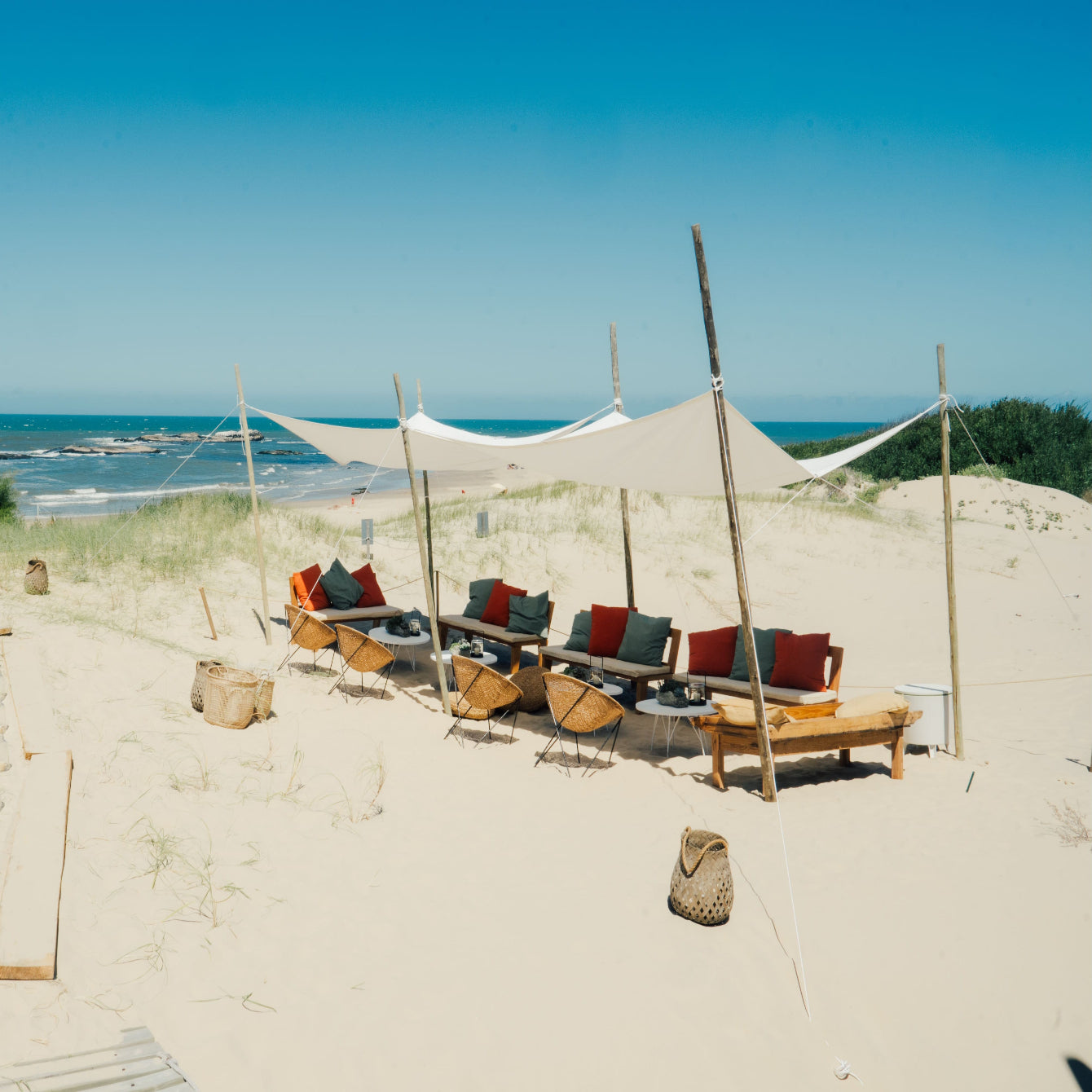 Private beach seating under canvas