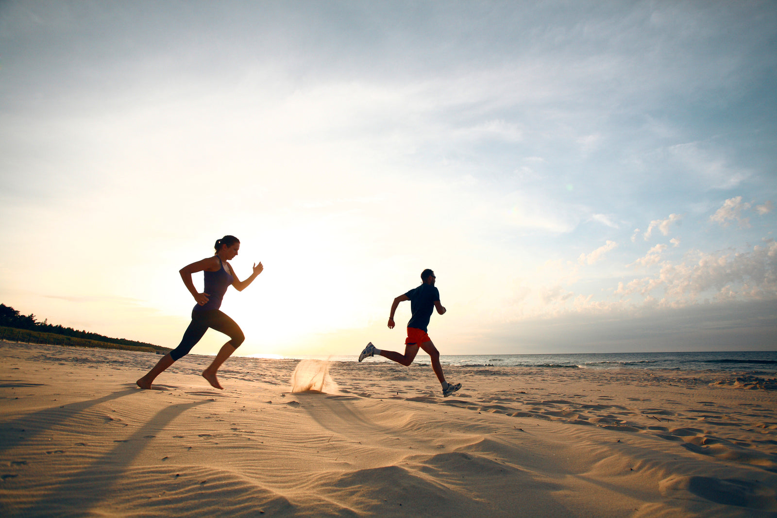 Morning run on the beach at sunrise